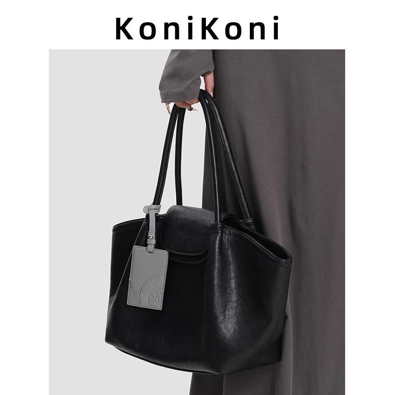 KoniKoni Genuine Leather Niche Black Large Capacity Tote Bag for Women, New Commuter Shoulder Handbag