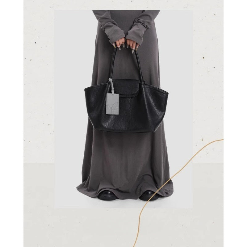 KoniKoni Genuine Leather Niche Black Large Capacity Tote Bag for Women, New Commuter Shoulder Handbag