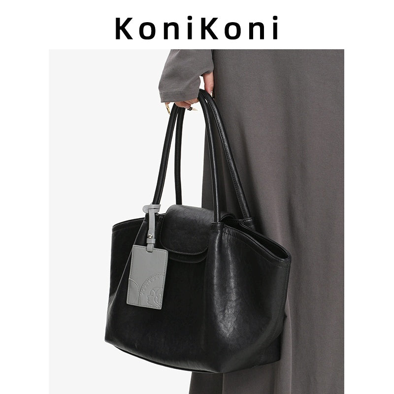 KoniKoni Genuine Leather Niche Black Large Capacity Tote Bag for Women, New Commuter Shoulder Handbag